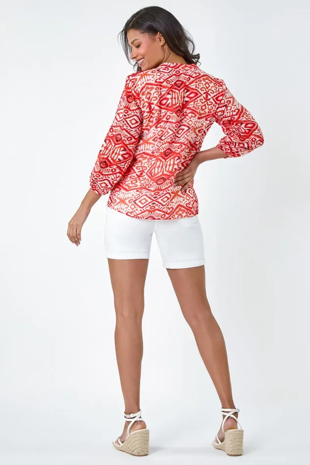 Women Orange Abstract Print Notch Neck Top Roman Tops